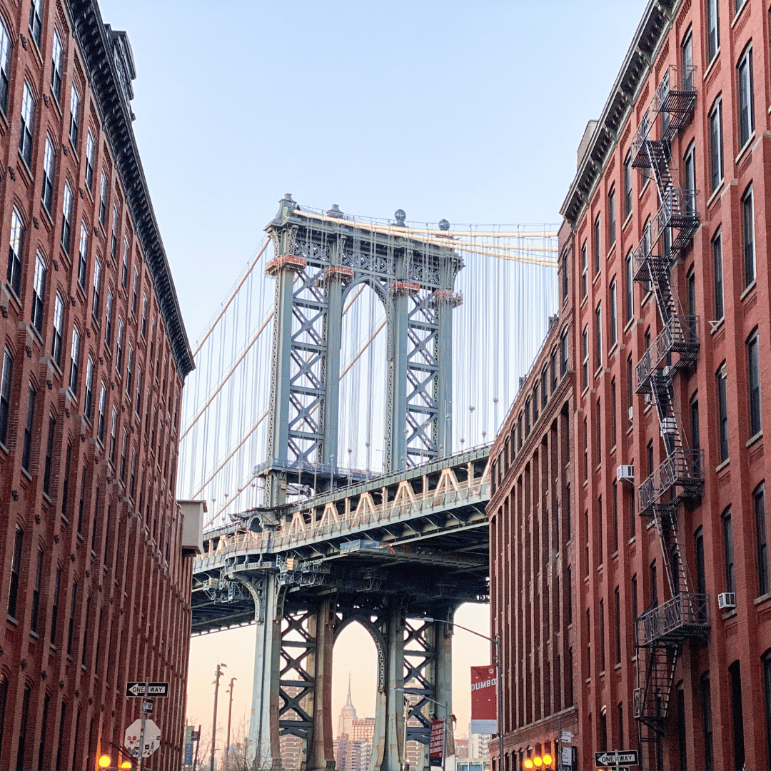 Brooklynn bridge photo with brownstone buildings